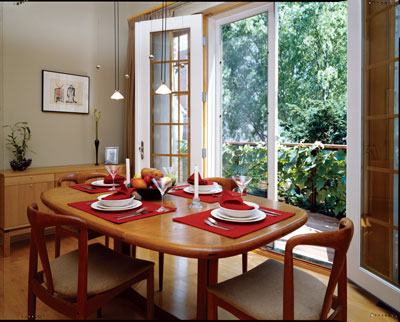 
Eight-foot French doors in the dining/kitchen area invite light into the original portion of the home and allow for spontaneous al fresco meals.
